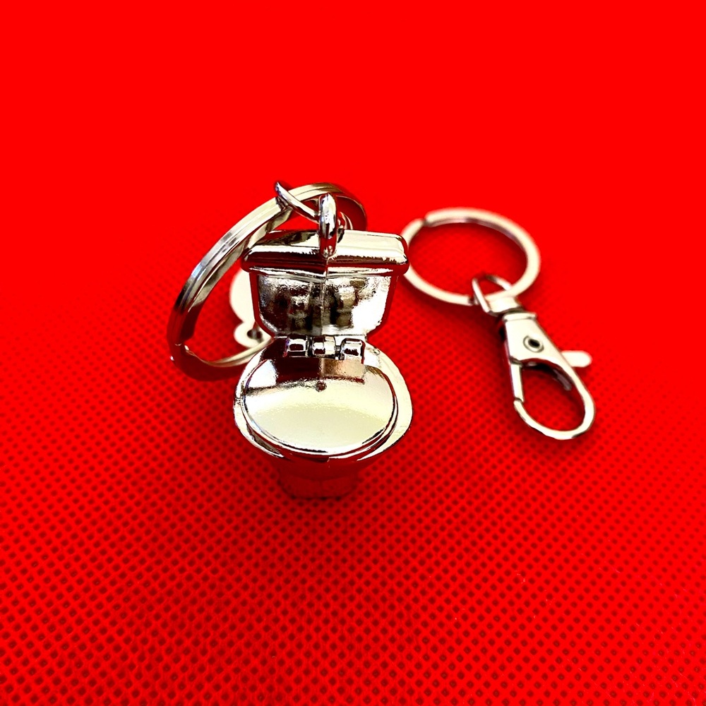 Yes this is a toilet seat bag charm/key chain!!!